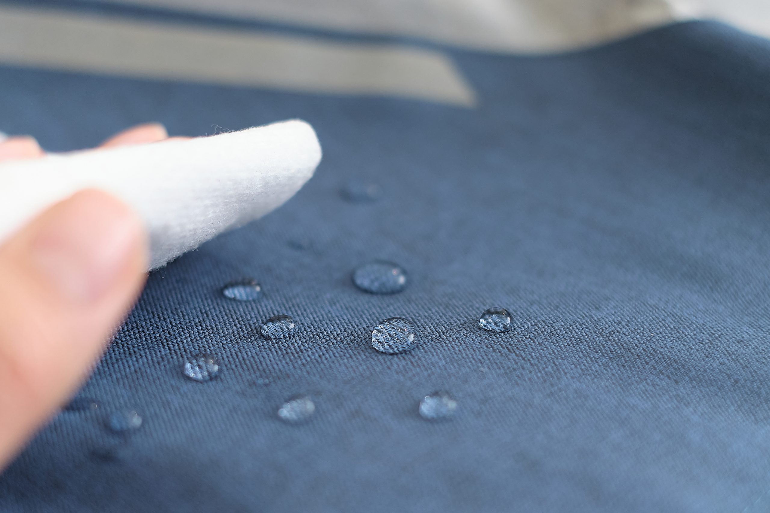Water droplets beading on treated upholstery fabric